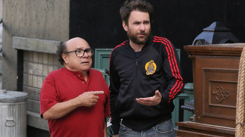 Danny DeVito as Frank and Charlie Day as Charlie gesturing at each other on It's Always Sunny in Philadelphia