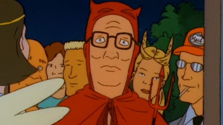 Hank Hill in a devil costume with Luanne, Boomhauer, Dale, and Bill behind him in various costumes