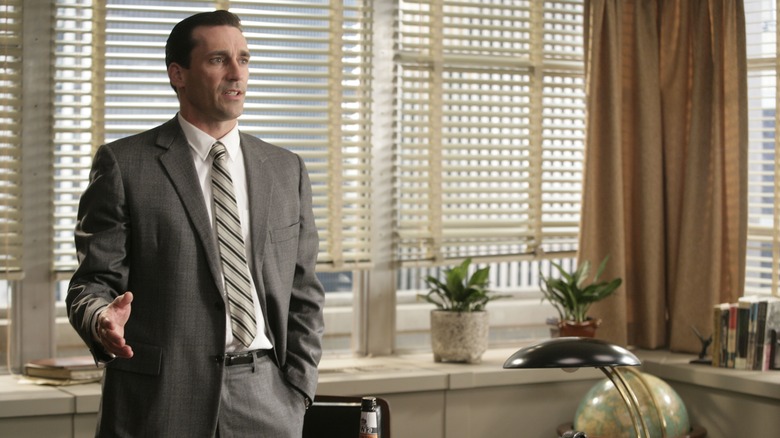 Don talking annoyed behind his desk on Mad Men