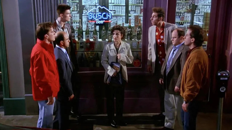 Tim DeKay as Kevin, Kyle T. Heffner as Gene, and Pat Kilbane as Feldman facing Michael Richards as Kramer, Jason Alexander as George, and Jerry Seinfeld as Jerry with Julia Louis-Dreyfus as Elaine in the middle on Seinfeld