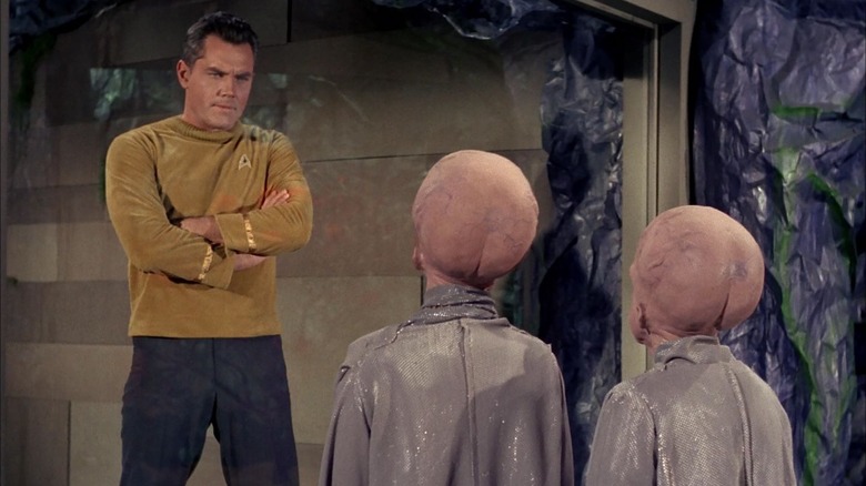 Captian Pike facing off against two Talosian on Star Trek