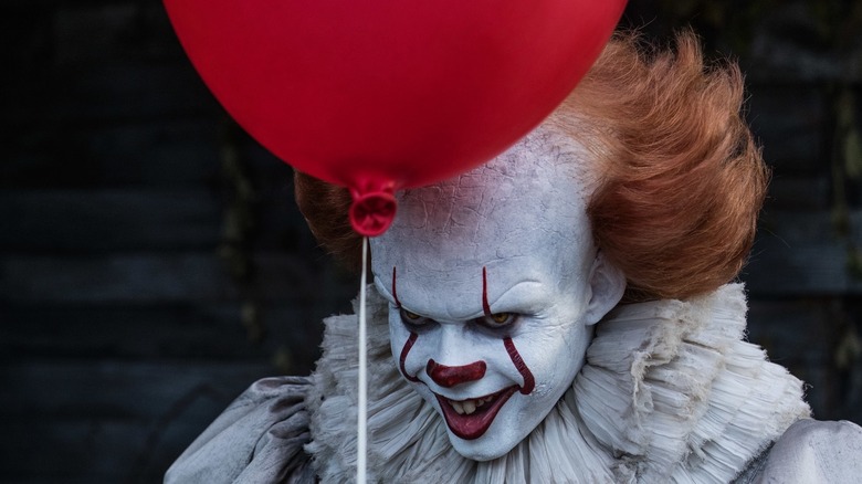Pennywise holding a balloon