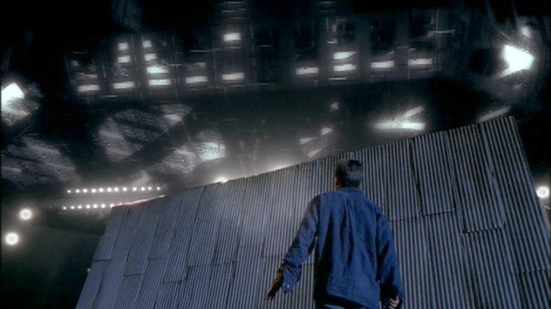 Mulder looking up at a spacecraft in The X-Files