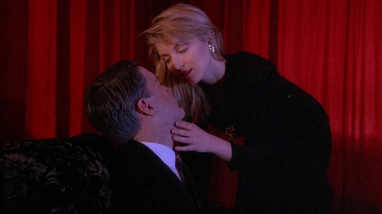 Laura whispering something in Cooper's ear in the Red Room in Twin Peaks