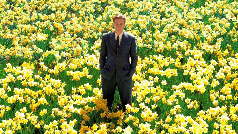 Edward Bloom standing in a field of daffodils in Big Fish
