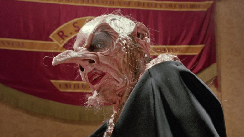 The Grand High Witch in front of a banner in The Witches (1990)