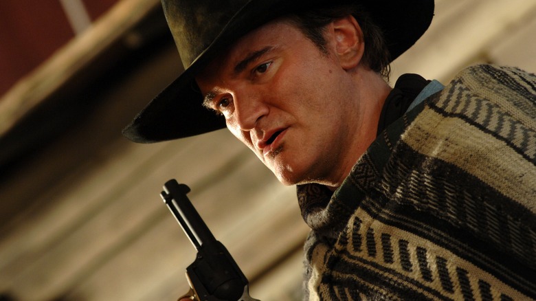 Piringo holding a gun in Sukiyaki Western Django