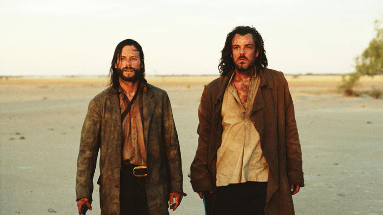 Charlie Burns and Captain Stanley trekking through the desert in The Proposition