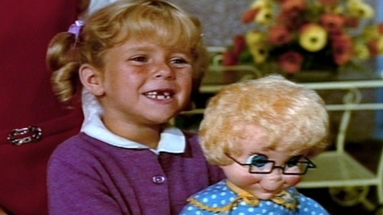 Anissa Jones as Buffy Davis grasps her precious doll Mrs. Beasley in Family Affair