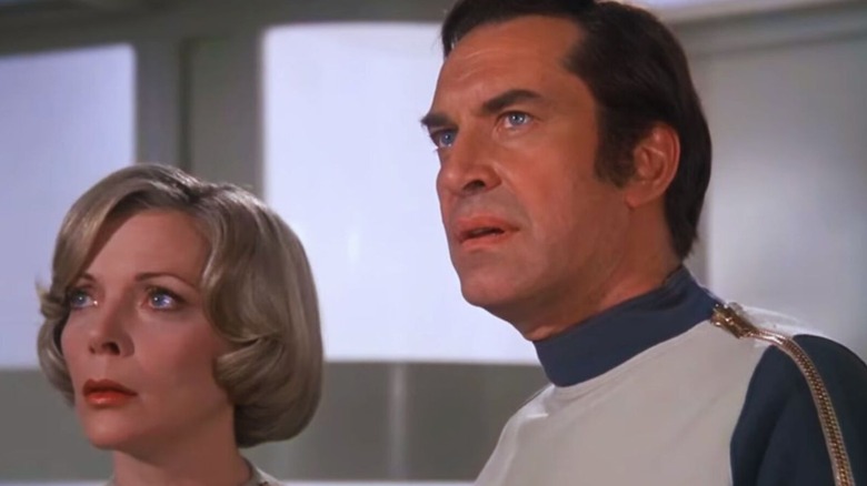 Helena Russell (Barbara Bain) and John Koenig (Martin Landau) stand next to each other in Space: 1999