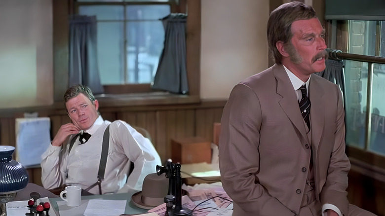 Sheriff Nye and Samuel Burgade hanging out in an office in "The Last Hard Men"