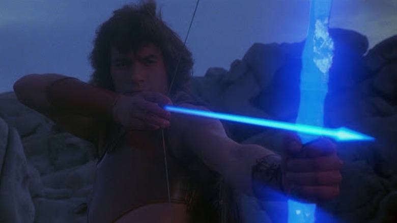 Andrea Occhipinti as Ilias draws back a magic arrow on his magic bow in Conquest