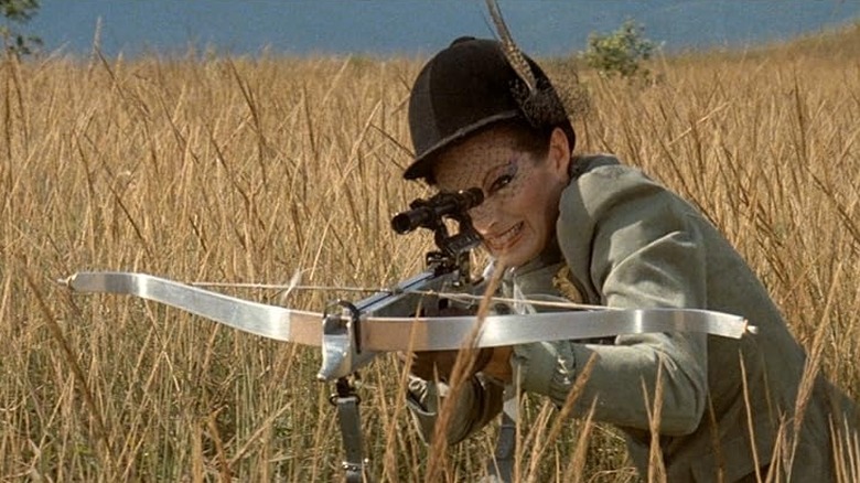 A fashionable woman with a high-tech crossbow in Turkey Shoot