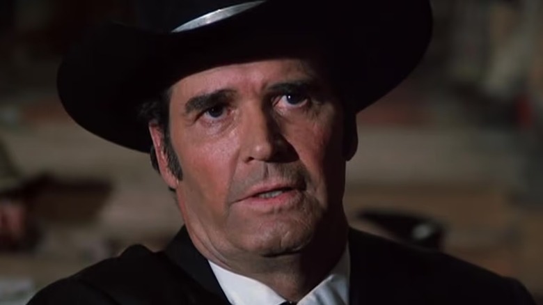 Bret Maverick (James Garner) sits back while speaking in Bret Maverick