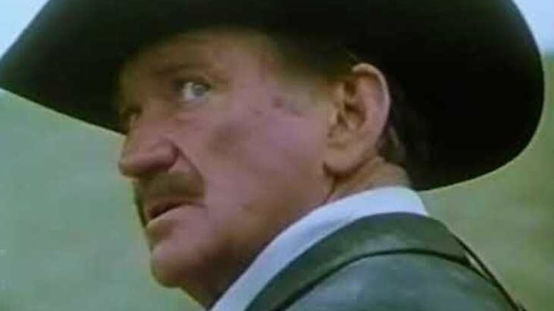 Sheriff Jonathan Grail (Rod Taylor) looks to his left in Outlaws (1986)