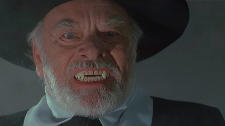 Ethan Jefferson (John Ireland) showing his fangs in "Sundown: The Vampire in Retreat"