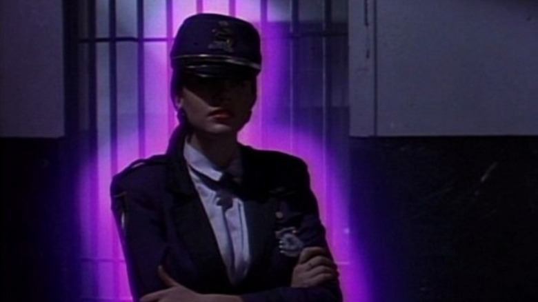 Mary Lou, glowing with an eerie purple light, in Prom Night III: The Last Kiss