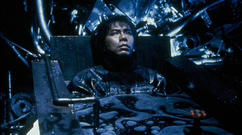 Yatsu in a pool of oil in Tetsuo II: Body Hammer