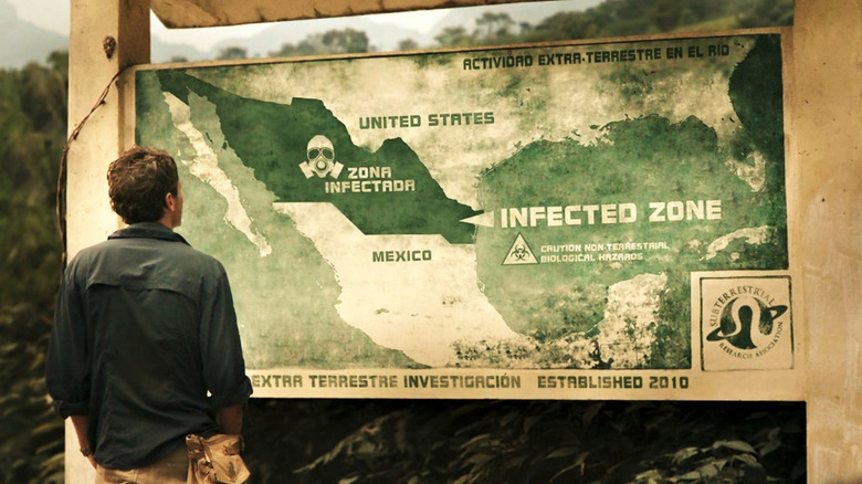Scoot McNairy as Andrew Kaulder looking at a map of infected zones in Monsters