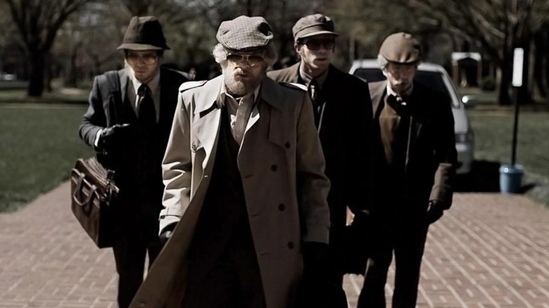 Spencer Reinhard, Warren Lipka, Eric Borsuk, and Chas Allen in disguise walking into the heist in American Animals