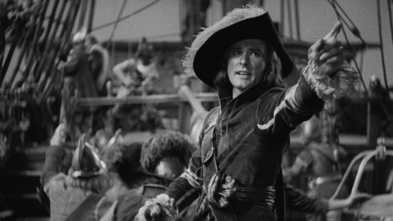 Peter Blood pointing dramatically in Captain Blood