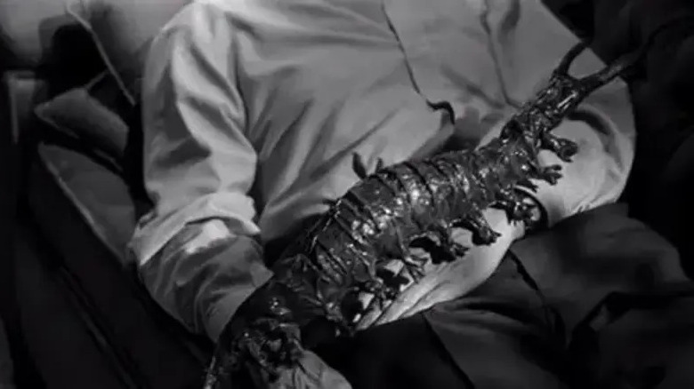 Someone holding the Tingler in their lap in The Tingler