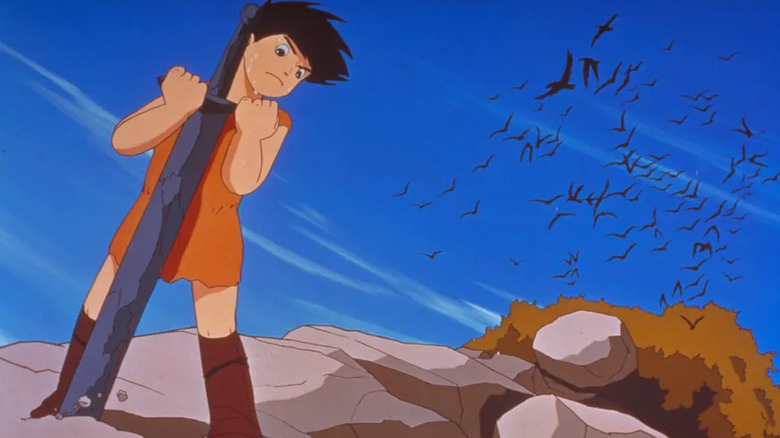 Horus trying to lift a giant sword from a rock in the ground in The Great Adventure of Horus, Prince of the Sun