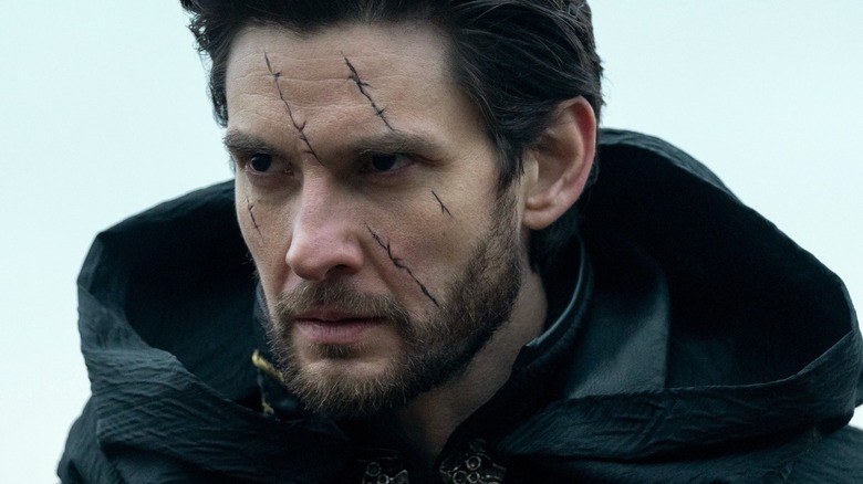 General Aleksander Kirigan looking gloomy and angry with a big sacar on his face in Shadow and Bone