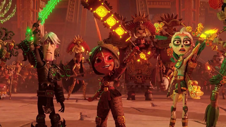 Zatz, Maya, and Chimi raising their weapons in celebration in Maya and the Three