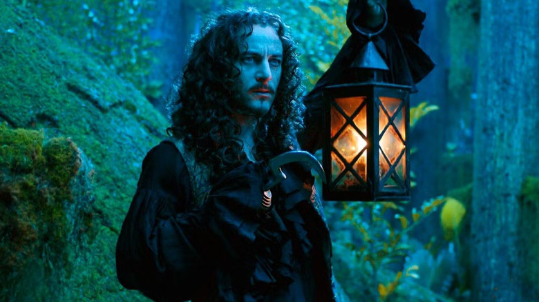 Captain Hook holding up a lantern in Peter Pan