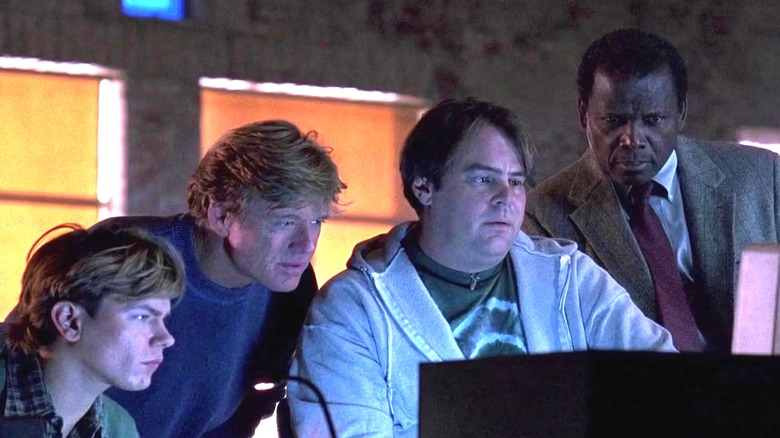 Carl, Bishop, Mother, and Crease in front of a computer in Sneakers