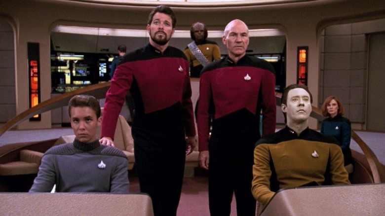Wesley, Riker, Worf, Picard, Data, and Dr, Crusher on the bridge of the Enterprise-D on Star Trek: The Next Generation