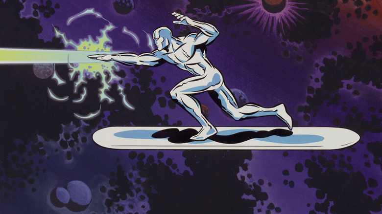 The Silver Surfer flying on his surfboard firing a hand blast in Silver Surfer