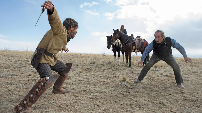 Tommy Lee Jones as George Briggs contends with a knife-wielding Tim Blake Nelson as Freighter in The Homesman