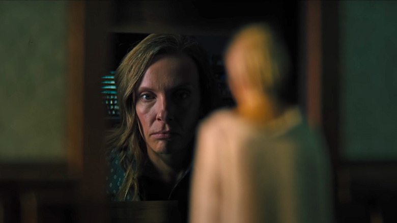 Annie Looks at a Miniature Doll of her Mother