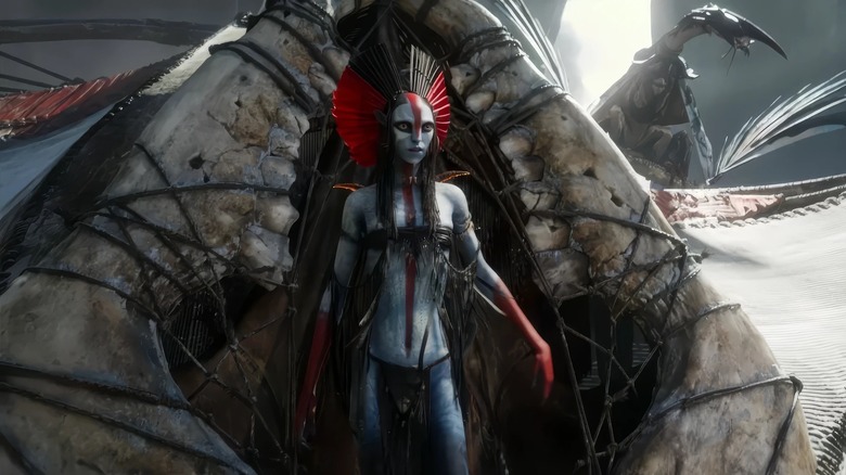 Oona Chaplin as the leader of the Ash People Varang wearing a colorful headdress in Avatar: Fire and Ash