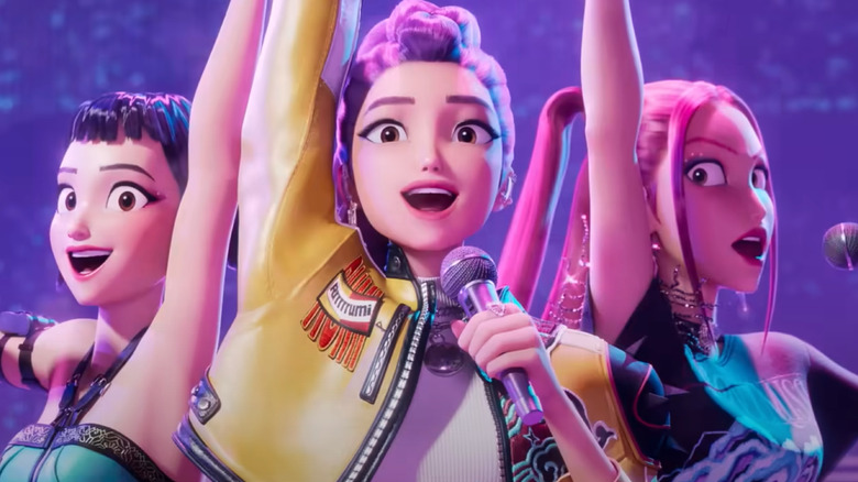 Huntr/x holding microphones while performing a song in KPop Demon Hunters