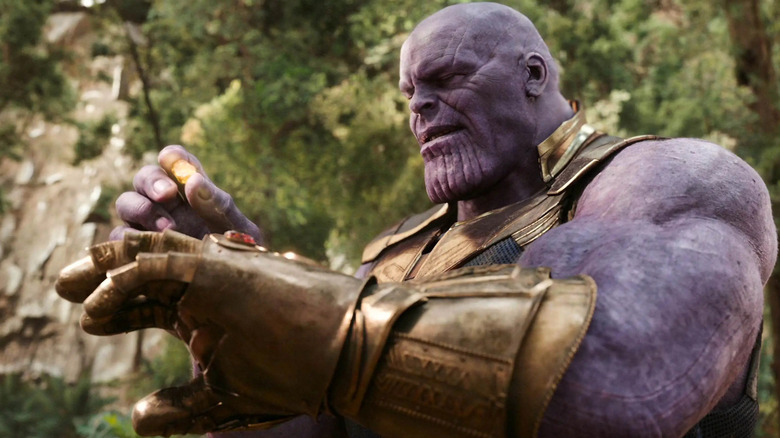 Thanos assembling the final Infinity Stone into the Infinity Gauntlet in Avengers: Infinity War