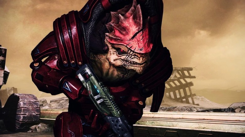 Mass Effect - Urdnot Wrex holding shotgun on desert planet