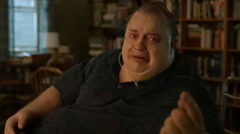 Charlie crying and reaching for someone in The Whale
