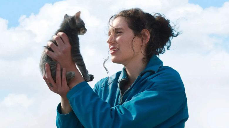 Agnes holding her kitten up in Sorry, Baby