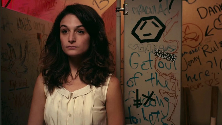 Donna staring into the mirror in a bathroom at the comedy club in Obvious Child