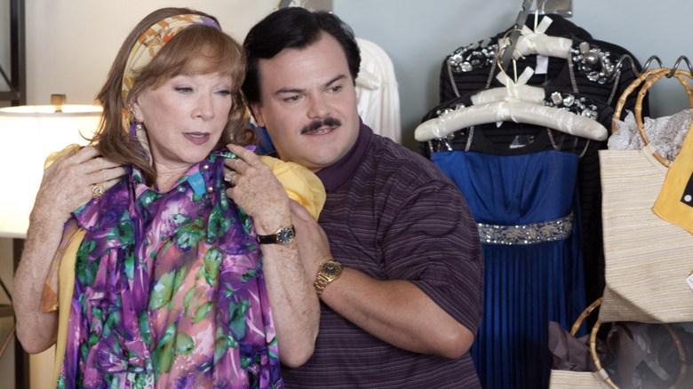 Shirley MacLaine as Margie Nugent and Jack Black as Bernie Tiede trying on dresses in Bernie
