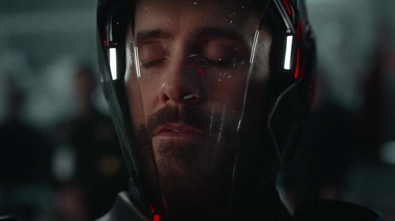 Jared Leto's Ares is seen behind a visor closing his eyes in closeup in Tron Ares.jpg