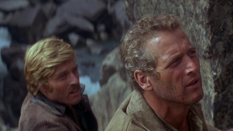 Paul Newman's Butch Cassidy and Robert Redford's Sundance Kid stand together behind some rocks in Butch Cassidy and the Sundance Kid.jpg