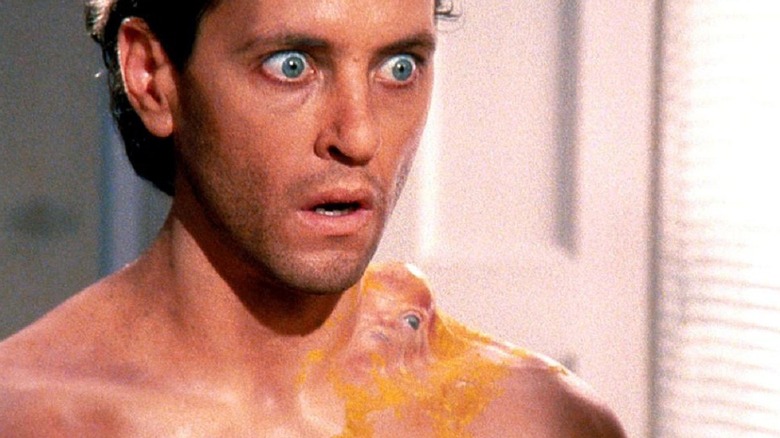 Dennis Bagley staring at a living boil on his neck in How to Get Ahead in Advertising