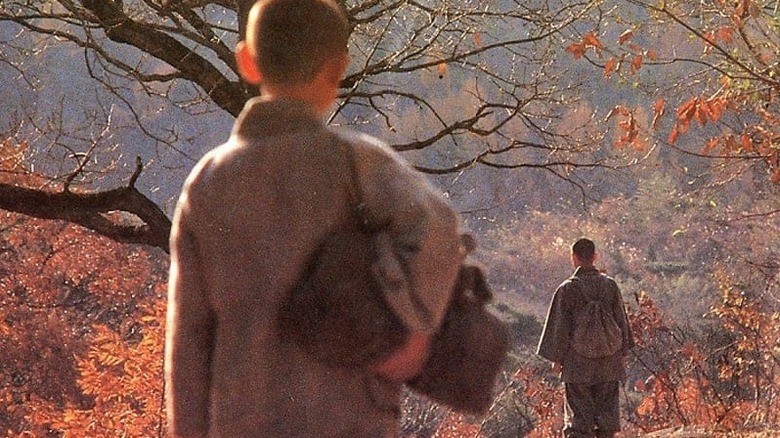 Hae-jin watching Ki-bong walk away past a tree in Why Has Bodhi-Dharma Left for the East?