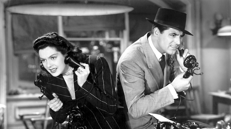 Hildy Johnson and Walter Burns listening to phone calls in "His Girl Friday"
