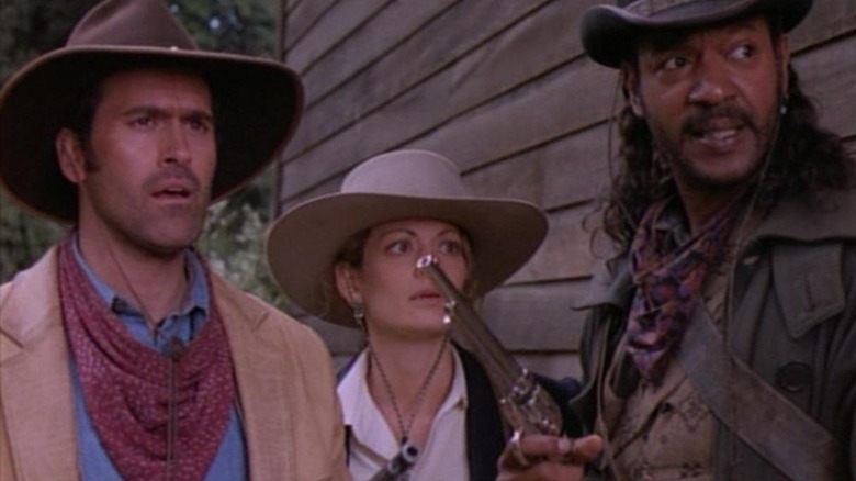 Brisco County and Lord Bowler in front of a fellow gunbslinger in The Adventures of Brisco County, Jr.