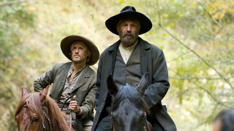 Matt Barr as Johnse Hatfield and Kevin Costner as Devil Anse Hatfield on horseback in Hatfields & McCoys
